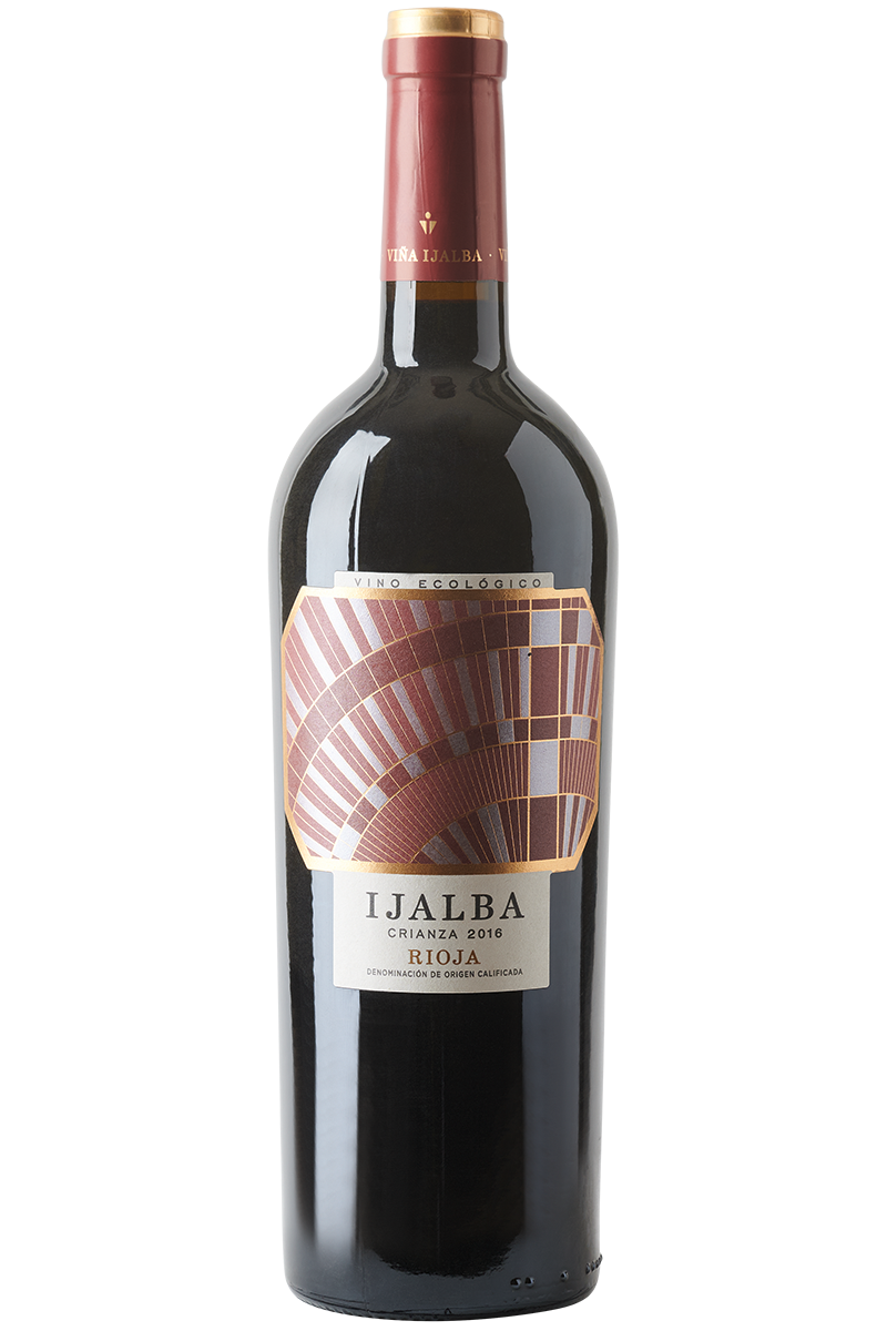 Eine Flasche spanischer Bio Rotwein in einer Bordeaux Flasche mit roter Kapsel.