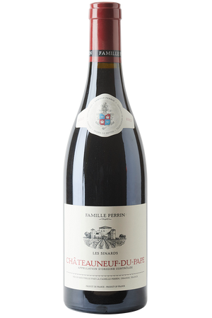 Eine Flasche französischer Rotwein Cuvee in einer Burgunderflasche mit einer roten Kapsel.