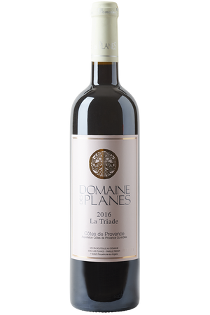 Eine Flasche französischer bio Rotwein Cuvée in einer Bordeaux Weinflasche mit einer grauen Kapsel.