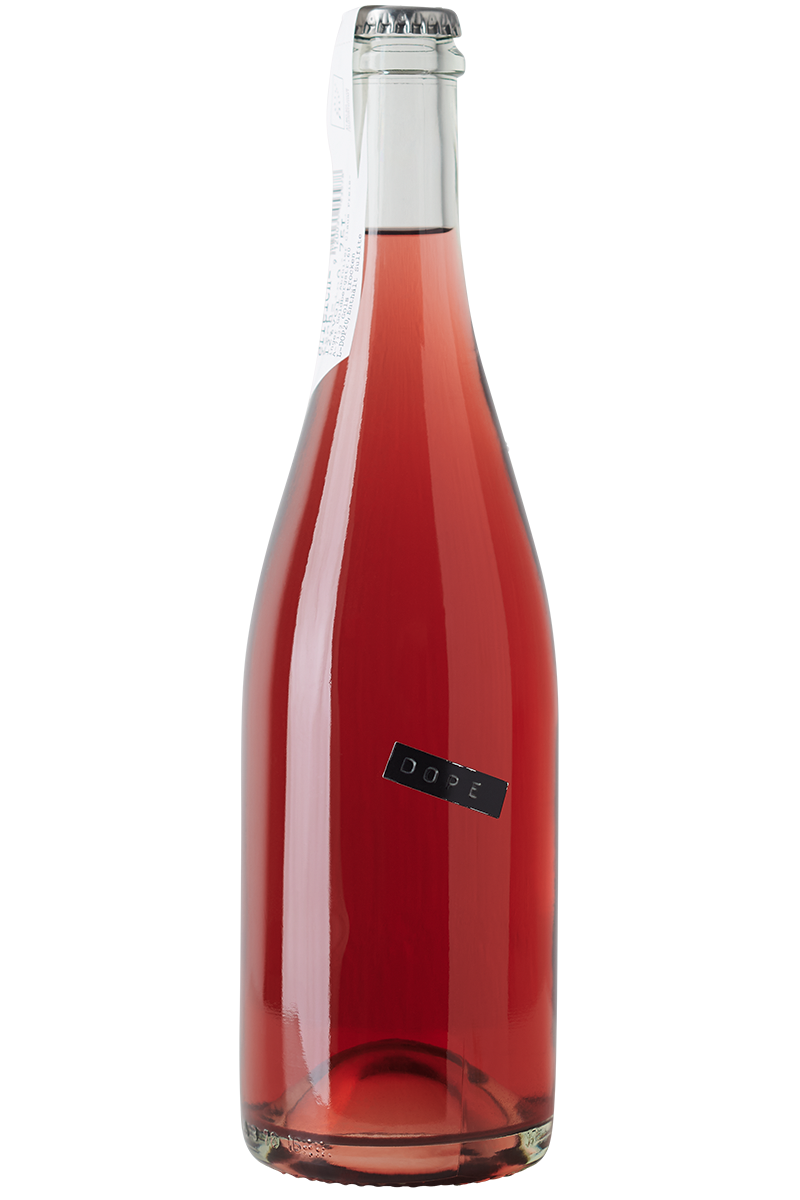 Eine Flasche Bio Sekt aus Österreich in einer weissen Sektflasche mit Kronkorken.